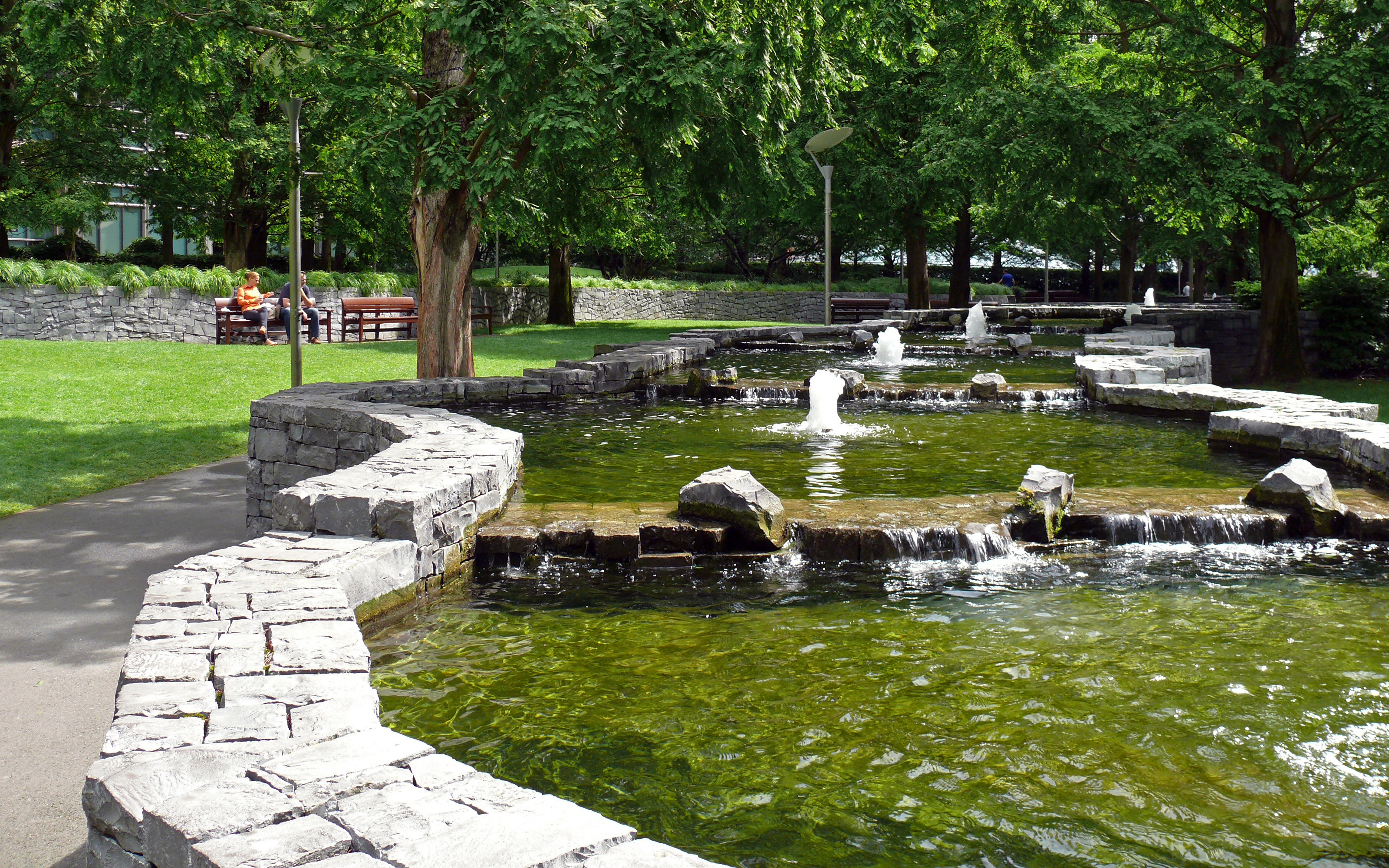 Channel-like water feature with small fountains