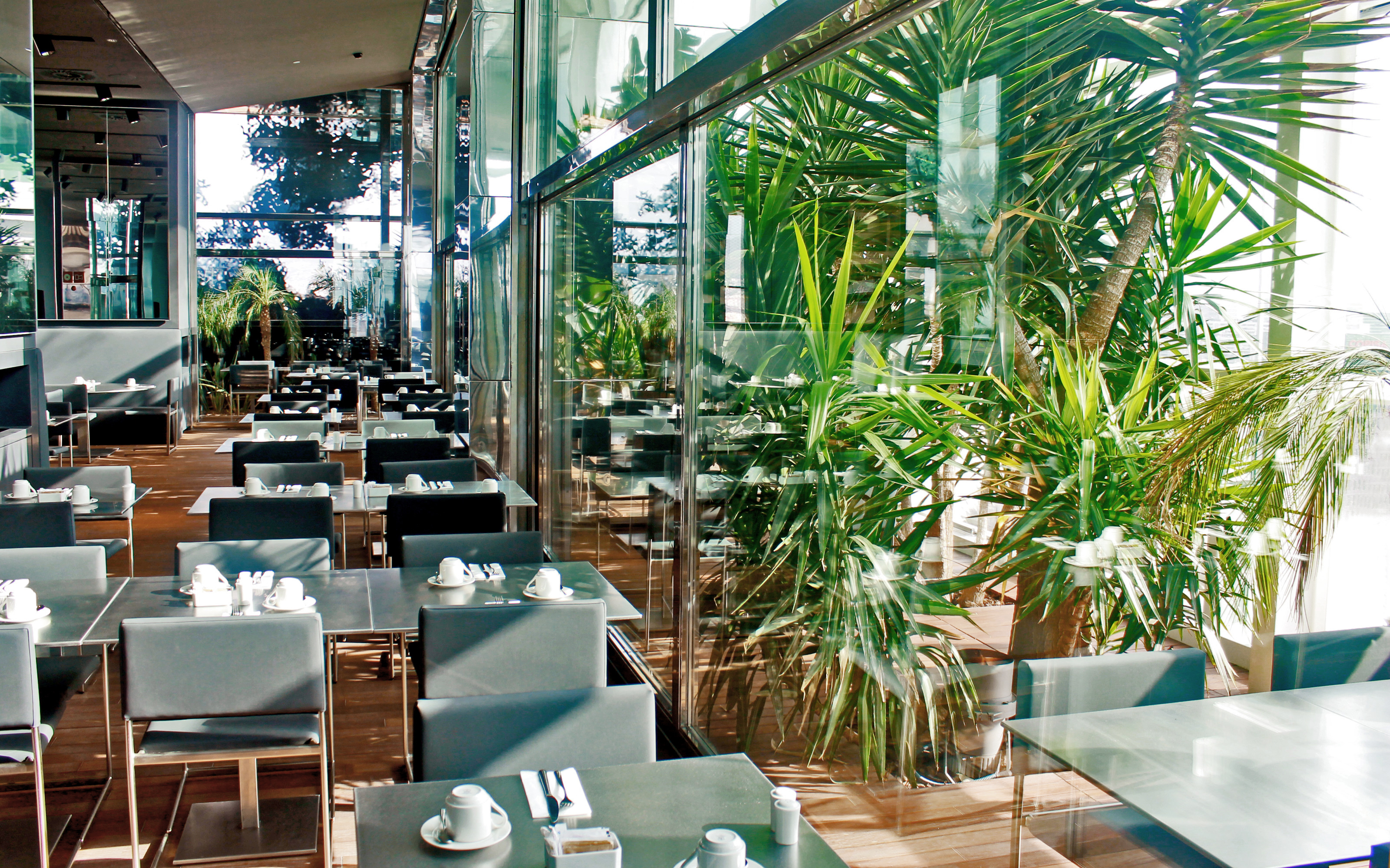 Tables in a restaurant surrounded by greenery