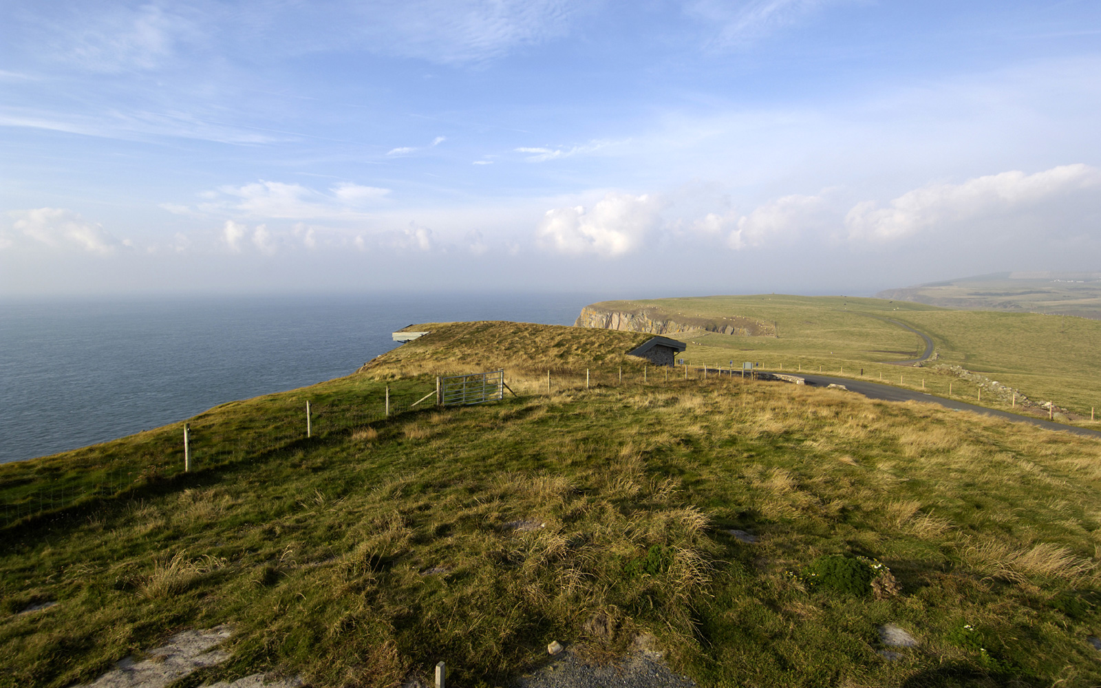 Building with green roof and surrounding grass and heather landscape