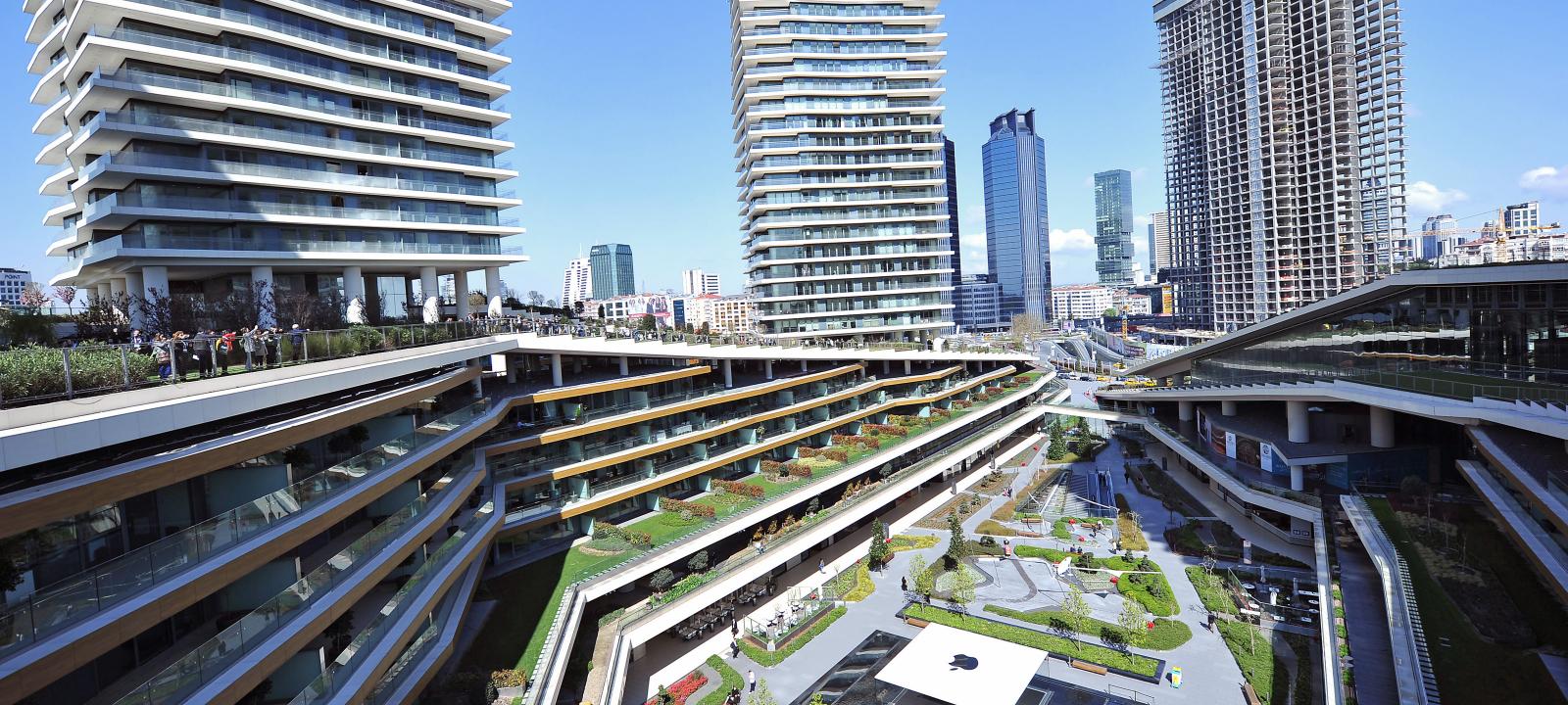 Large building with lucious vegetation on various levels