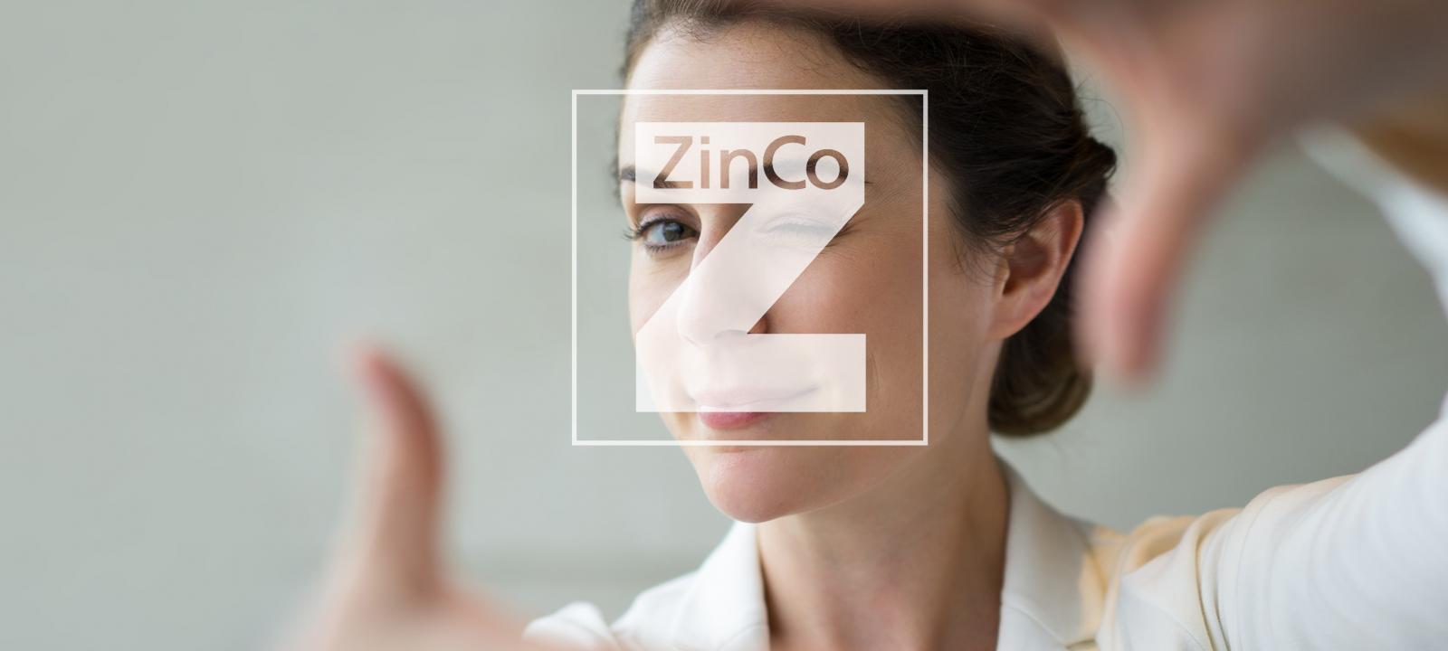 Hands making frame around ZinCo Logo