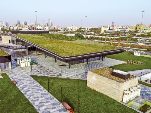 Green roofs in a park with walkways and lawn