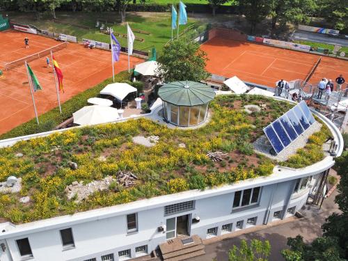 Tennis court with a green roof