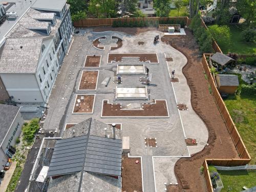 During installation of a roof garden with vegetated and hardscaped areas