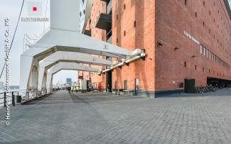 Brick building and harbour cranes