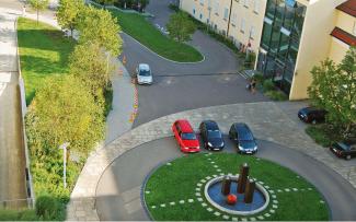 Roundabout with lawn and water feature