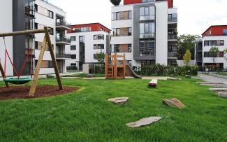 Residential complex with lawn and playground