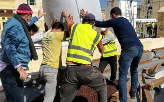 Substrate is being lifted onto a roof