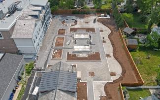 During installation of a roof garden with vegetated and hardscaped areas