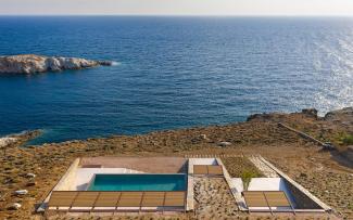 Private property with a swimming pool and a view onto the sea